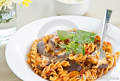 Fusilli with mushroom in tomato sauce Stock Photo
