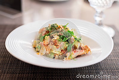 Fusion of Mexican cuisine and a traditional seafood crab salad. Closeup of Blood Orange Crab Posole Salad with fresh cooked Stock Photo