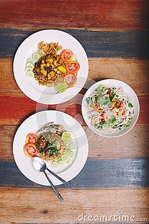 Fusion Thai Meal: Top view of Fried rice Mackerel Paste with Thai Mackerel, Thai Pineapple Fried Rice and Spicy rice vermicelli wi Stock Photo