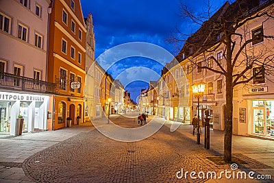 Shops and restaurants open late at night around quiet downtown of Fussen, Germany Editorial Stock Photo