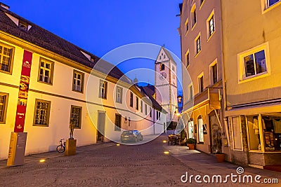 Shops and restaurants open late at night around quiet downtown of Fussen, Germany Editorial Stock Photo