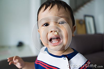 Fussy baby with snots dripping on his face stock photo Stock Photo