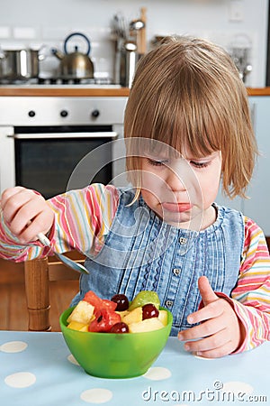 Fussy Child Rejecting Delicious Fruit Salad Pudding Stock Photo