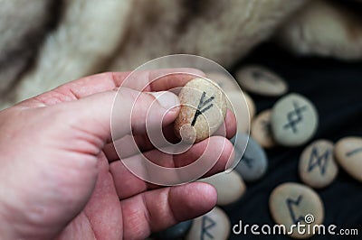 Stone runes on the hand Stock Photo