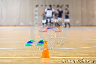 Futsal Training Field. Indoor Soccer Practice Session. Kids with Coach Training Football Stock Photo