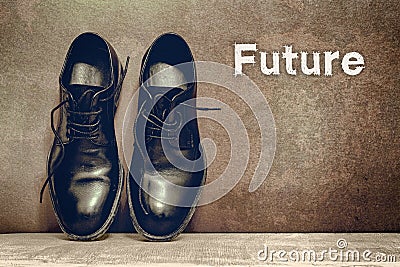 Future on brown board and work shoes on wooden floor Stock Photo