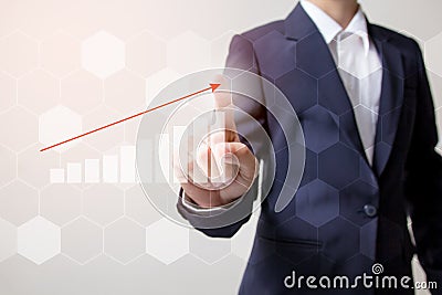 Future of financial business concept,Businessman touching increasing graph with finance symbols. Stock Photo