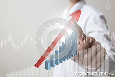 Future of financial business concept,Businessman touching increasing graph with finance symbols . Stock Photo