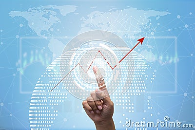 Future of financial business concept,Businessman touching increasing graph with finance symbols. Stock Photo