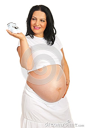 Future mom holding babys bootee Stock Photo