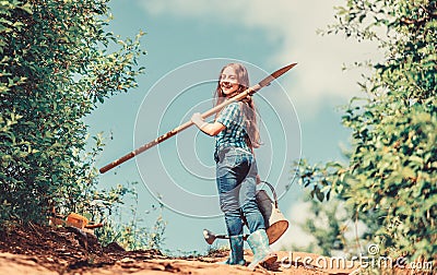 Future success. small girl on rancho. summer farming. farmer small girl. garden tools, shovel and watering can. kid Stock Photo