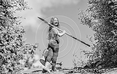 Future success. small girl on rancho. summer farming. farmer small girl. garden tools, shovel and watering can. kid Stock Photo