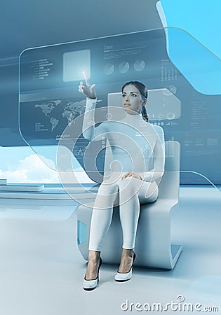 Future technology. Girl press button touchscreen interface. Stock Photo