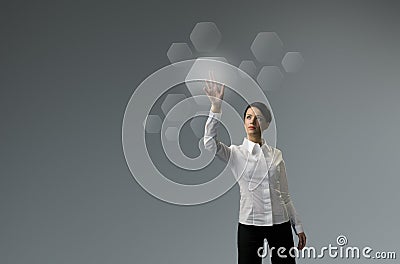 Future technology. Girl press button touchscreen interface. Stock Photo