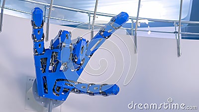 Futuristic big blue mechanical robotic hand showing devil horn gesture Editorial Stock Photo