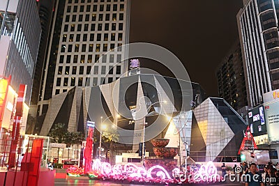 Futuristic building surrounded from corporate buildings in shopping destrict with lighted christmas and chinese New Year decoratio Editorial Stock Photo
