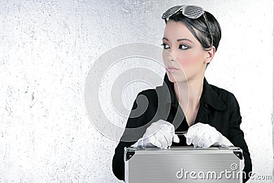 Futuristic businesswoman holding silver briefcase Stock Photo