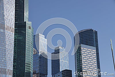 Futuristic design part of skyscrapers against a clear blue sky. Abstract facade design. Glass and metal in modern urban Editorial Stock Photo