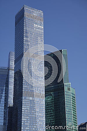 Futuristic design part of skyscrapers against a clear blue sky. Abstract facade design. Glass and metal in modern urban Editorial Stock Photo