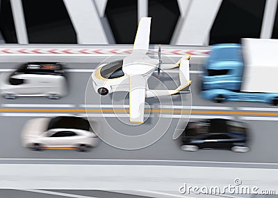 Futuristic flying car flying over the highway Stock Photo