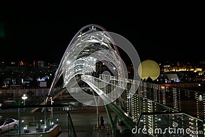 Night view of the `Bridge of Peace` in Tbilisi. Georgia Country Editorial Stock Photo