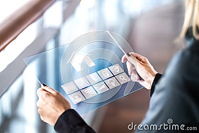 Futuristic smart home control inferface in transparent tablet. Stock Photo