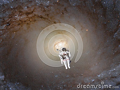 Futuristic view of space walk cosmonaut into spiral galaxy Stock Photo