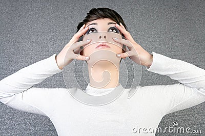 Futuristic woman fashion portrait fingers on face Stock Photo