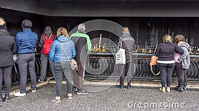 Pilgrims Paying Promise`s by Burning Candles in Fatima Editorial Stock Photo