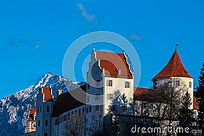 FÃ¼ssen High Castle with Tegelberg in winter Stock Photo