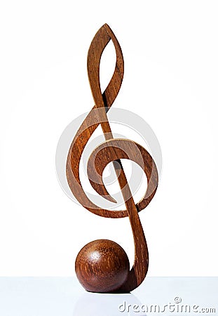 G-clef icon carved from wood Stock Photo