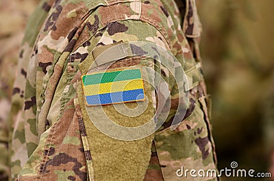 Gabonese Republic flag on soldiers arm. Gabon troops collage Stock Photo