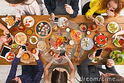 Gadget device addiction, friends dinner with smarphones Stock Photo