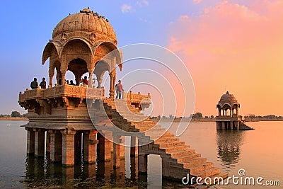 Gadi Sagar temple on Gadisar lake at sunset, Jaisalmer, India Editorial Stock Photo