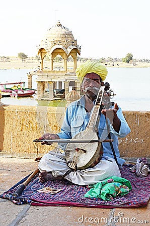 Musician with Sarod at Gadsisar Sagar Lake, Jaisalmer, Rajasthan, India Editorial Stock Photo