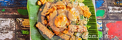Gado-gado Indonesian salad served with peanut sauce. Ingredients: tofu, spinach, string beans, soy sprouts, potatoes Stock Photo