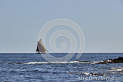 Gaff Rigged Sailing Boat on smooth sea Stock Photo