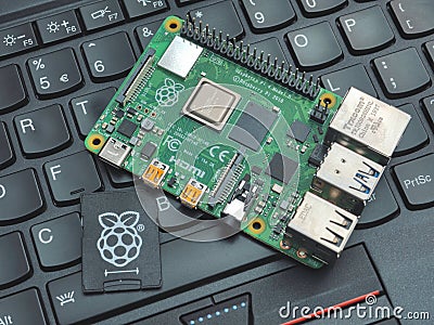 Galati, ROMANIA - March 20, 2020: Close-up of a Raspberry Pi 4 Model-B on a laptop keyboard. The Raspberry Pi is a credit-card- Editorial Stock Photo