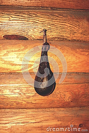 Gall bladder of a bear while drying on a log wall Stock Photo