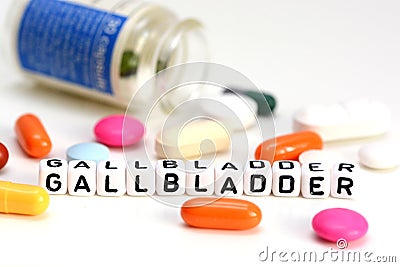 Gallbladder problems concept with colorful drugs out of container and gallbladder word from white cubes Stock Photo