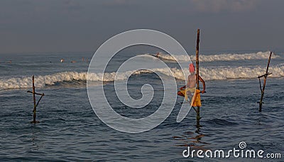 Galle, Sri Lanka - 2019-04-01 - Stilt Fishermen of Sri Lanka Spend All Day on Small Platforms to Catch Fish for Dinner Editorial Stock Photo