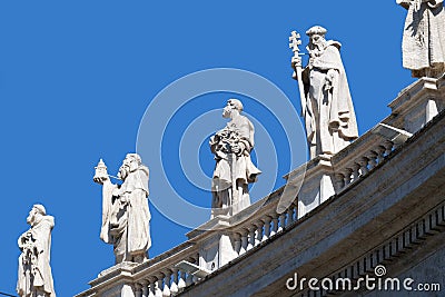 Gallery of saints, fragment of colonnade of St. Peters Basilica in Rome Stock Photo