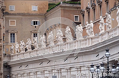 Gallery of saints, fragment of colonnade of St. Peters Basilica, Rome Stock Photo
