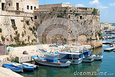 Gallipoli, Angevin castle with fishing boats Stock Photo