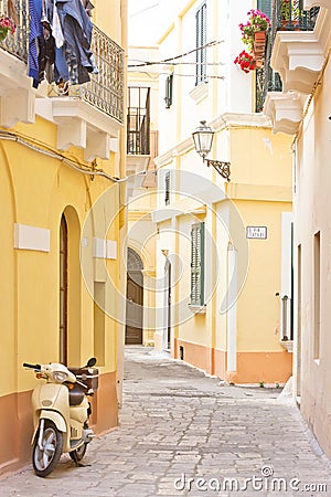 Gallipoli, Apulia - A motor scooter in a historical alleyway Stock Photo