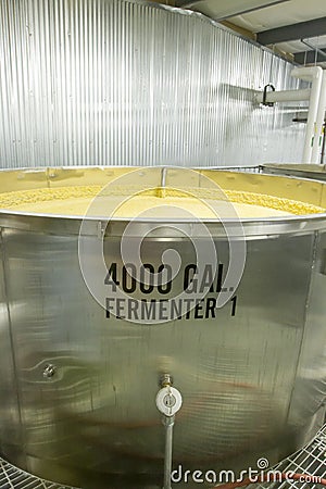 400 gallon aluminum fermenting tanks with mash Stock Photo