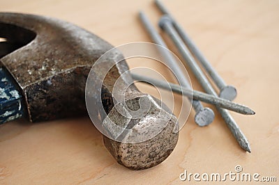 Galvanized Nails and a Claw Hammer Stock Photo