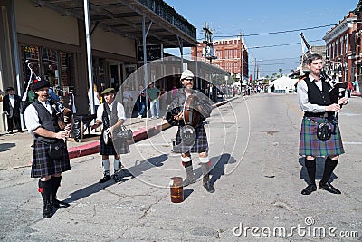 Galveston, TX/USA - 12 06 2014: Men dressed as Scottish musicians play harp at Dickens on the Strand Festival in Galveston, TX Editorial Stock Photo