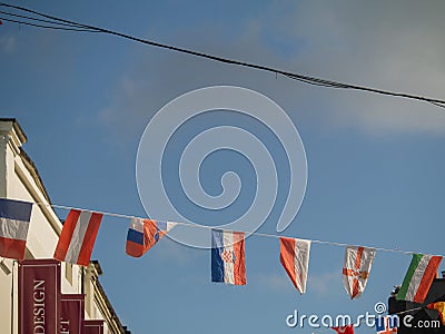07/03/2019 Galway city, Ireland. European countries hanging over Shop street Editorial Stock Photo