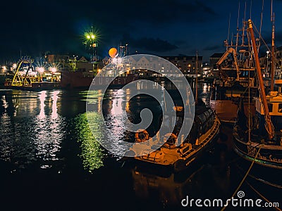 Galway - Ireland / 10/08/2020: Commercial ships in Galway Harbor illuminated at night Editorial Stock Photo